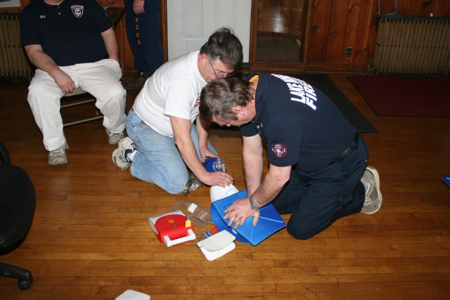 Bob & Ken Demonstrate Compressions And Breathing For A Victim