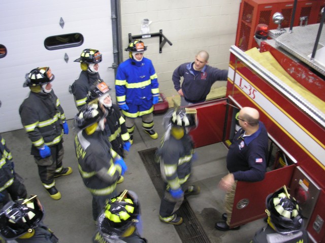 New Probationary Firefighters Learn The Equipment On The Apparatus At Headquarters