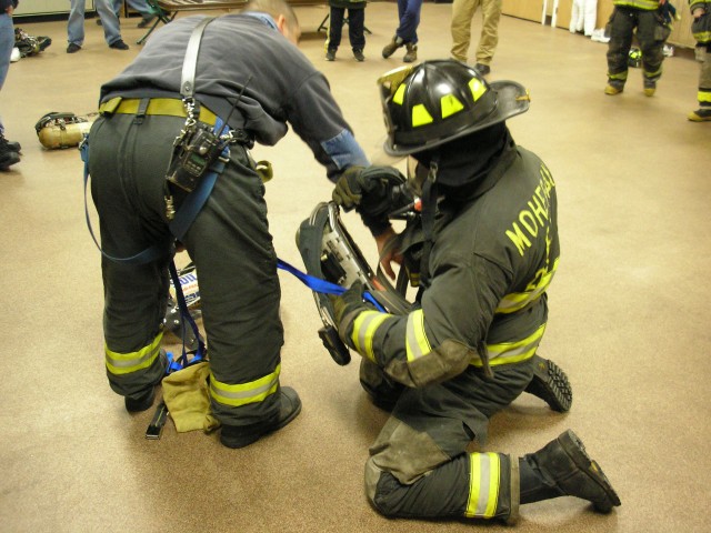 Firefighter Gurdineer Sweeps His Airpack To Find What He's Caught On