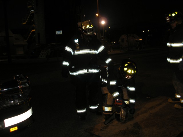 Lt. Tartaglia Watching The Back Of A Probie While He Makes The Cut
