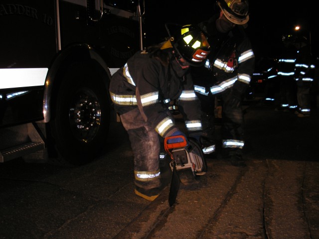 Probationary Firefighter Gorbecki Trying Her Hand At The Quick Vent Saw