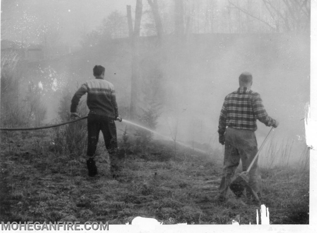 Members fighting a brush fire 