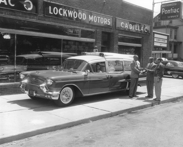 08/08/1957 MVFA President Thomas Rockett (on the left) at Lockwood Motors Accepting A New Cadillac Ambulance