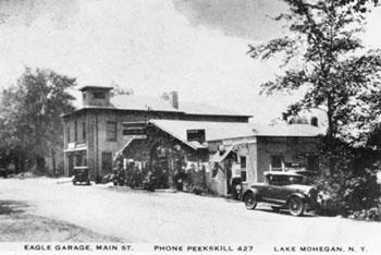 The Eagle Garage, owned by the Travis family. The newly constructed fire station is in the background (Circa 1927) (Courtesy of Yortown Histircial Society)