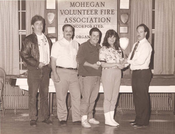 Capt. Egans Presents Award To Rescue Squad Crew for Delivering Baby in 1991